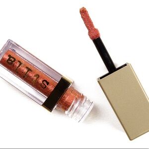 Stila
Glitter & Glow Liquid Eyeshadow orange pink gold deep peach melon